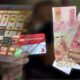 Ilustrasi Atm Dan Transaksi Bansos Yang Terindikasi Judi Online