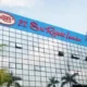 Ilustrasi Kantor Pusat Pt Sritex Dan Logo Kpk Dalam Latar Skandal Korupsi Kredit